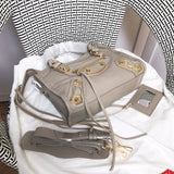 Back view of polished classic women's handbag – women's luxury accessory