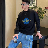 Flat lay presentation of Louis Vuitton luxury clothing with streetwear-inspired cut