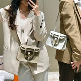 Side view of understated structured handbag