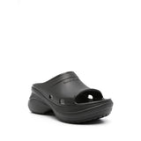 Close-up of Balenciaga sandals hardware and fine stitching