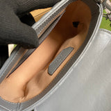 Close-up detail of statement polished women's handbag – women's luxury accessory