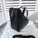 Handle and strap detail of refined signature women's handbag – women's luxury handbag