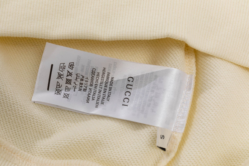 Close-up detail shot of Gucci luxury clothing with relaxed-fit cut
