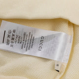 Close-up detail shot of Gucci luxury clothing with relaxed-fit cut