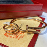 Close-up detail view of Cartier unisex jewelry piece