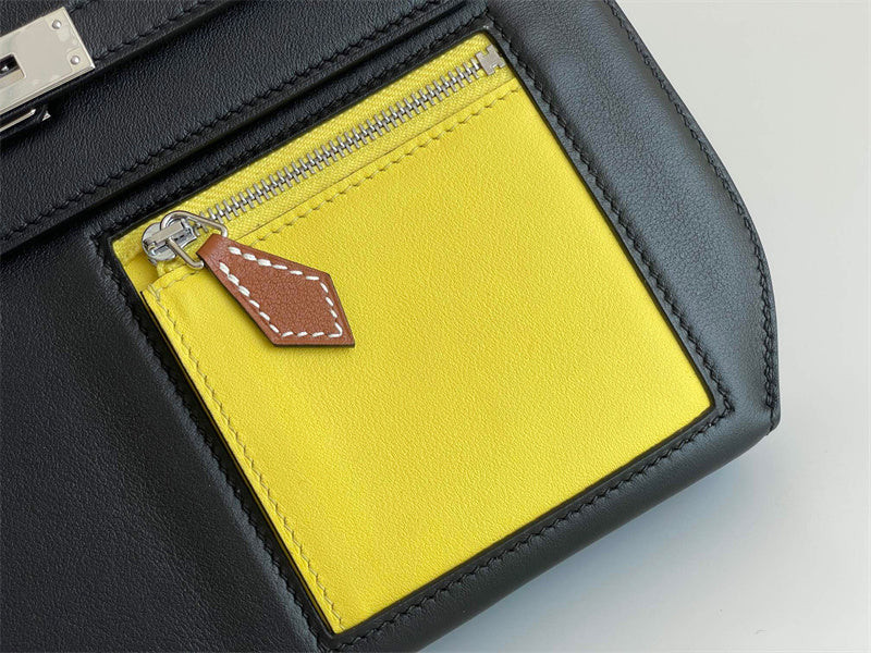 Side view of clean-lined structured handbag