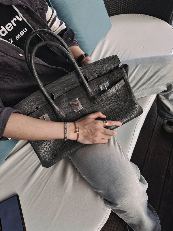 Side view of polished structured handbag