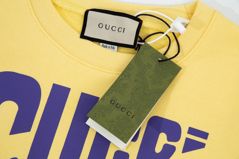 Full styled look of Gucci luxury clothing with signature branding