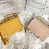 Side view of minimalist structured handbag