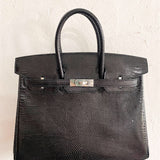 Side view of graceful structured handbag