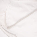 Flat lay presentation of Louis Vuitton luxury clothing with logo-detail design