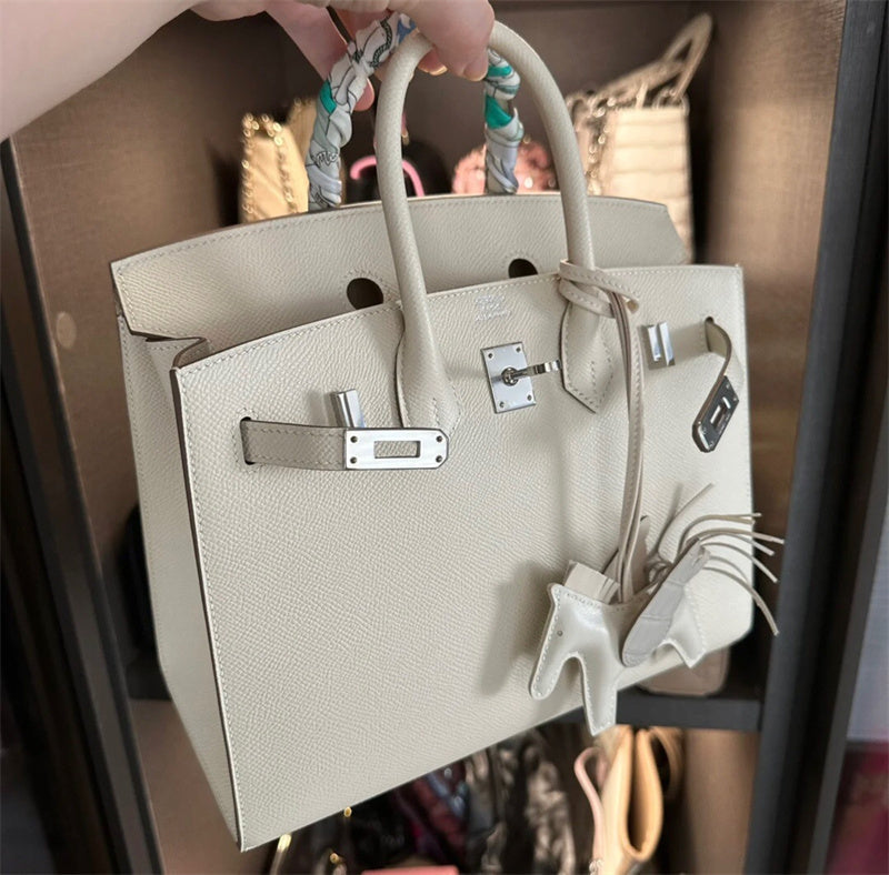  Signature satchel carried on shoulder 10