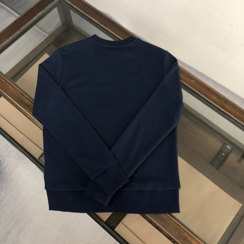 Close-up detail shot of Gucci luxury clothing with relaxed-fit cut