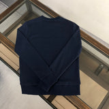 Close-up detail shot of Gucci luxury clothing with relaxed-fit cut