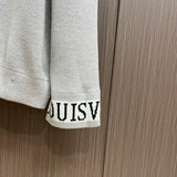 Back view of Louis Vuitton luxury clothing with signature branding
