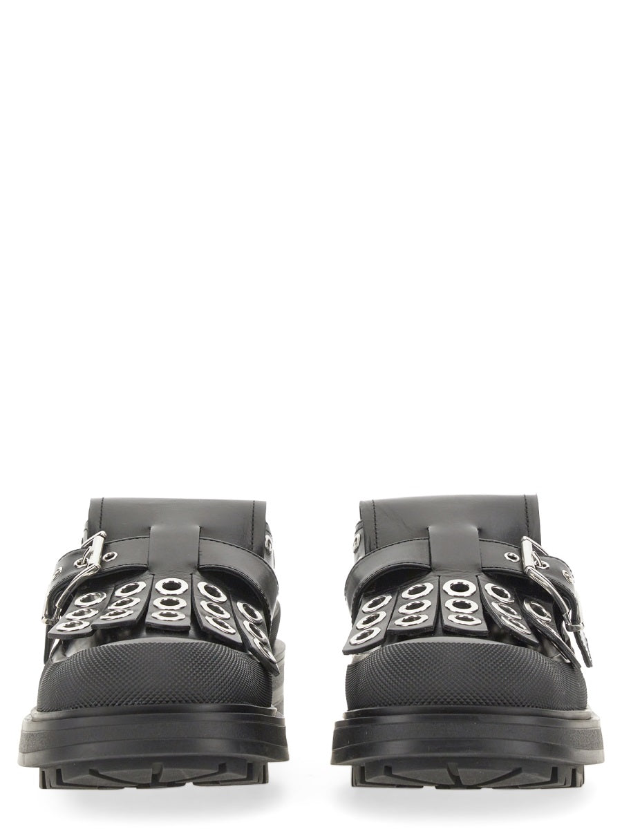 Close-up of Alexander McQueen slides hardware and fine stitching