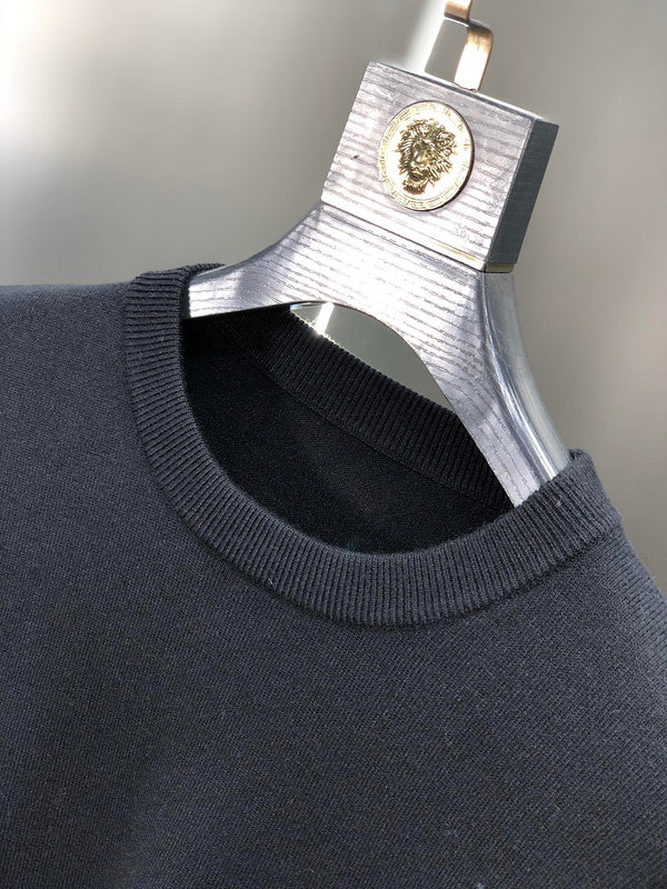 Flat lay presentation of Louis Vuitton luxury clothing with tailored silhouette