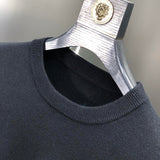 Flat lay presentation of Louis Vuitton luxury clothing with tailored silhouette
