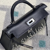  timeless top-handle bag detail view showing craftsmanship 8