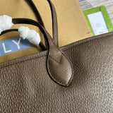 Back view of polished modern women's handbag – women's luxury accessory