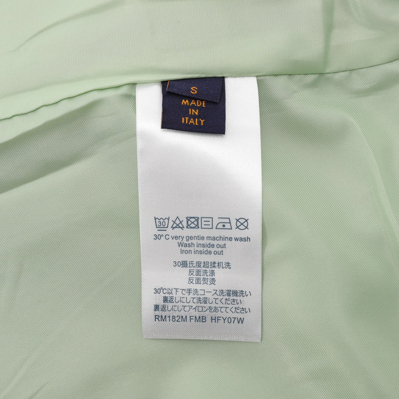 Side profile of Louis Vuitton luxury clothing with logo-detail design