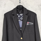 Close-up detail shot of Louis Vuitton luxury clothing with logo-detail design