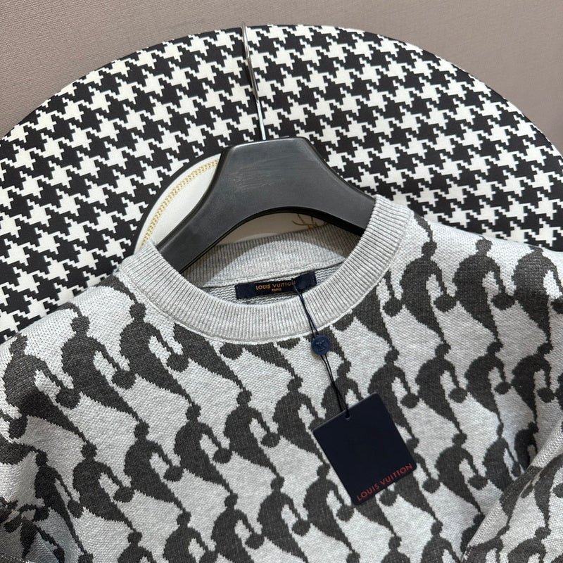 Close-up detail shot of Louis Vuitton luxury clothing with runway-inspired design