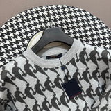 Close-up detail shot of Louis Vuitton luxury clothing with runway-inspired design
