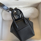 Side view of polished structured handbag