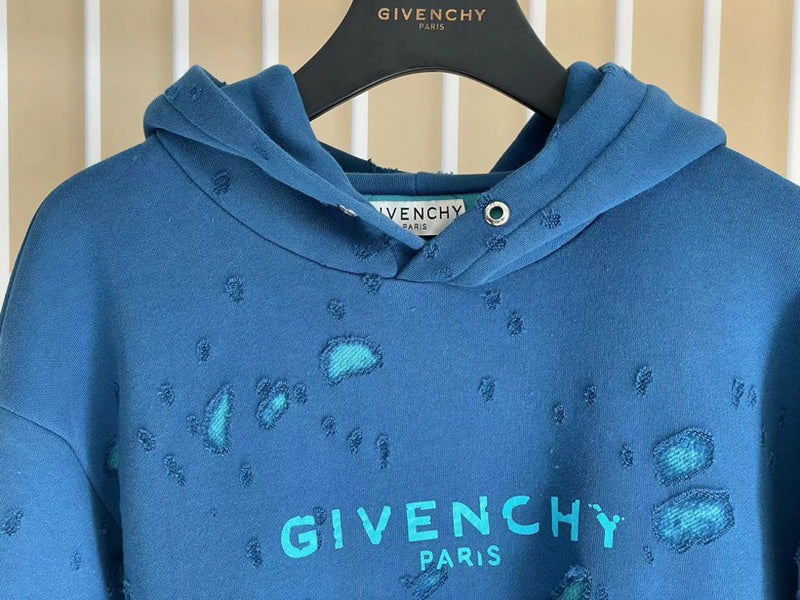 Flat lay presentation of Givenchy luxury clothing with logo-detail design