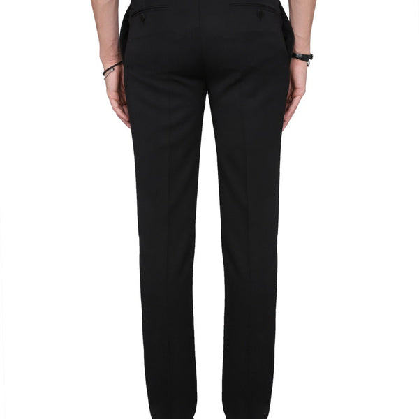 Close-up of Alexander McQueen pants hardware and fine stitching