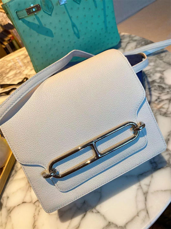 Side view of fluid structured handbag