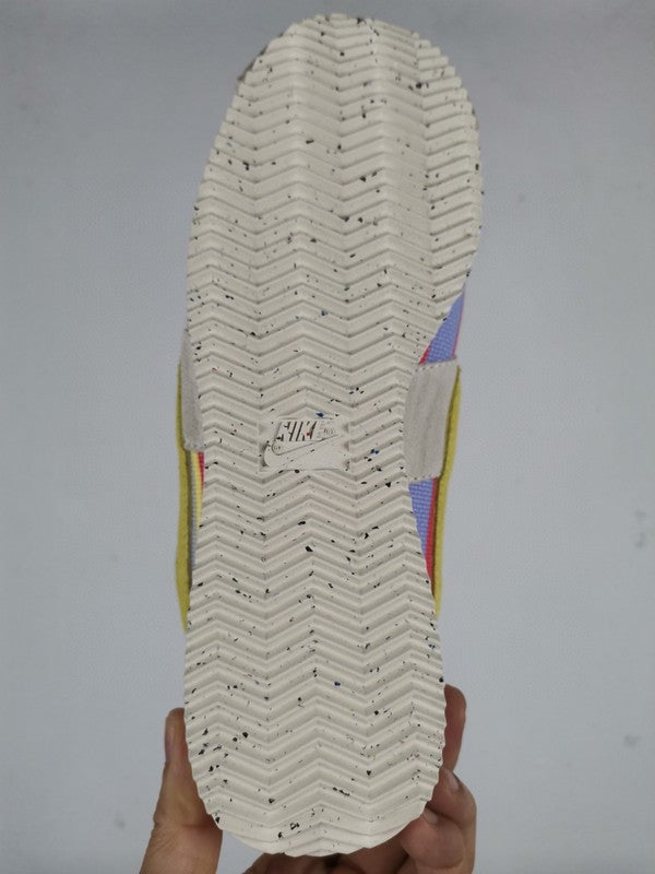 Side profile of Nike crisp white sneakers heritage-inspired look