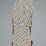 Side profile of Nike crisp white sneakers heritage-inspired look