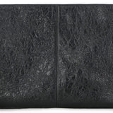 Close-up of Balenciaga pochettes hardware and fine stitching