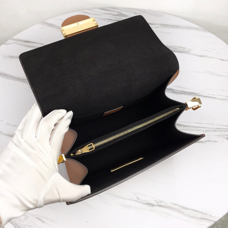 Back view of modern signature women's handbag – women's designer-style accessory