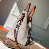 Side profile of elevated everyday-luxe women's handbag – women's luxury accessory