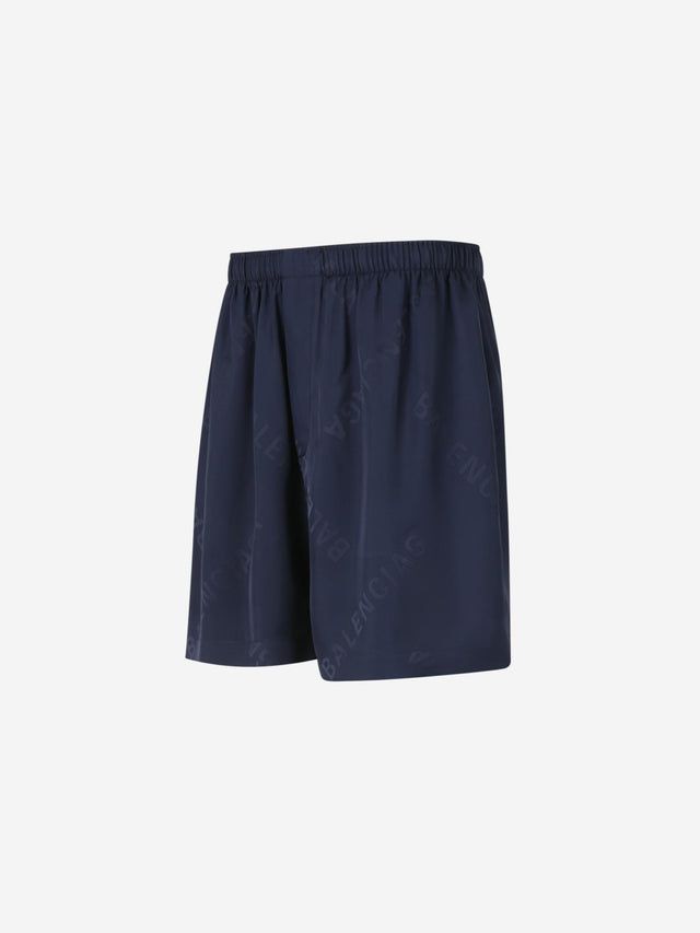 Close-up of Balenciaga pants hardware and fine stitching