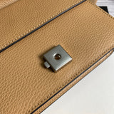 Close-up detail of sleek polished women's handbag – women's statement bag