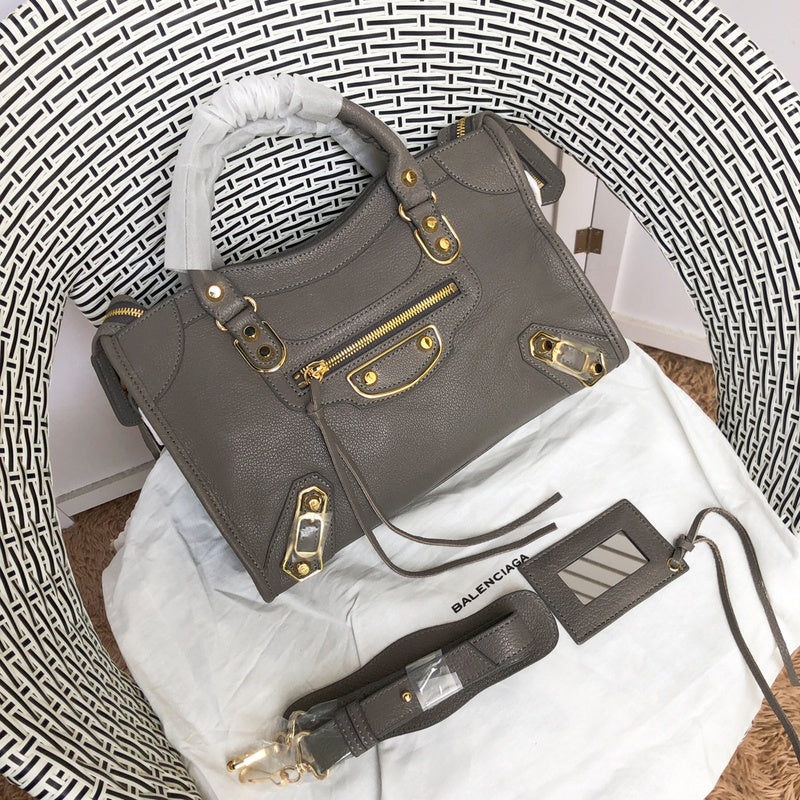 Front view of sleek polished women's handbag – women's luxury accessory