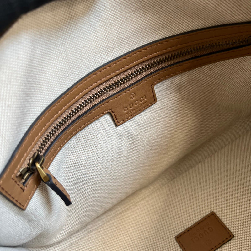 Side profile of structured polished women's handbag – women's everyday handbag