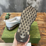 Side profile of Gucci classic monochrome sneakers heritage-inspired look