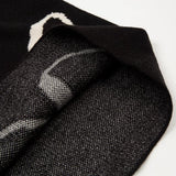 Flat lay presentation of Rhude luxury clothing with monogram-inspired silhouette