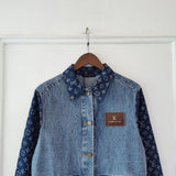 Close-up detail shot of Louis Vuitton luxury clothing with logo-detail design