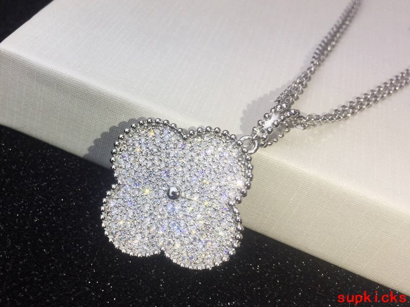 Lifestyle view of Van Cleef & Arpels unisex jewelry piece
