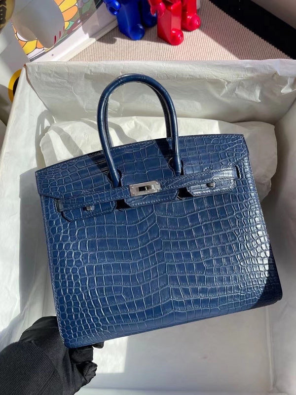 Side view of streamlined structured handbag