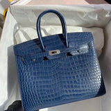 Side view of streamlined structured handbag