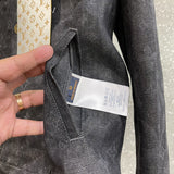 Close-up detail shot of Louis Vuitton luxury clothing with monogram-inspired silhouette