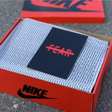 Side profile of Nike two-tone sneakers sleek tonal finish