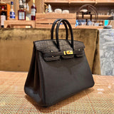  sophisticated top-handle bag styled with outfit
